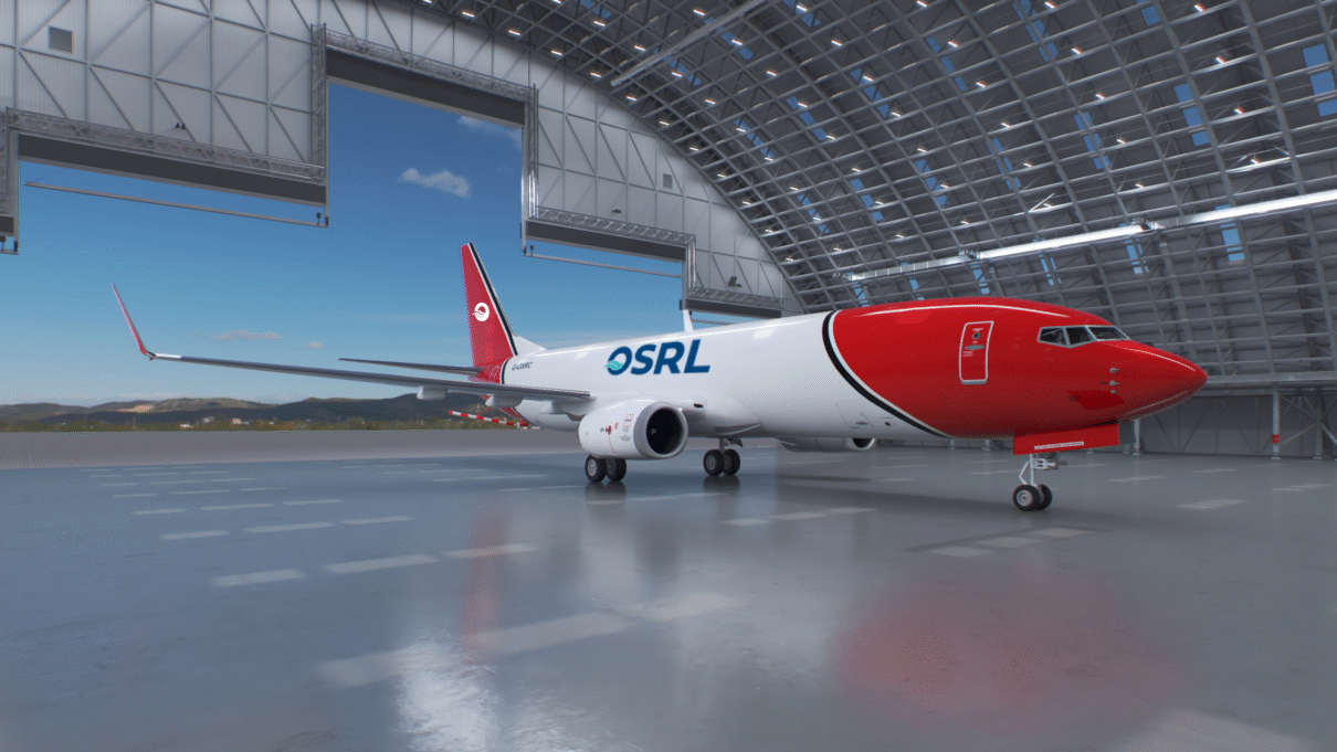 red and white boeing aircraft with blue osrl logo inside a hangar