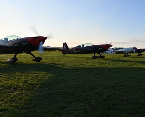 3 aircraft on grass