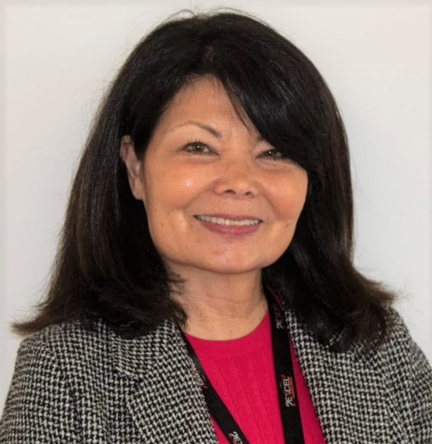 Cheri Bates wearing red top and grey jacket