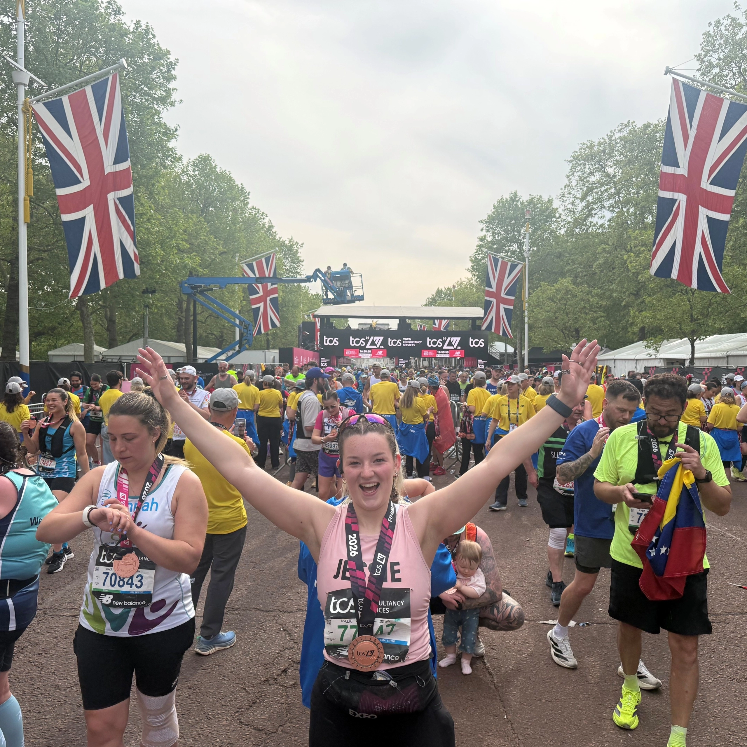 blonde girl in pink top with medal on the Mall